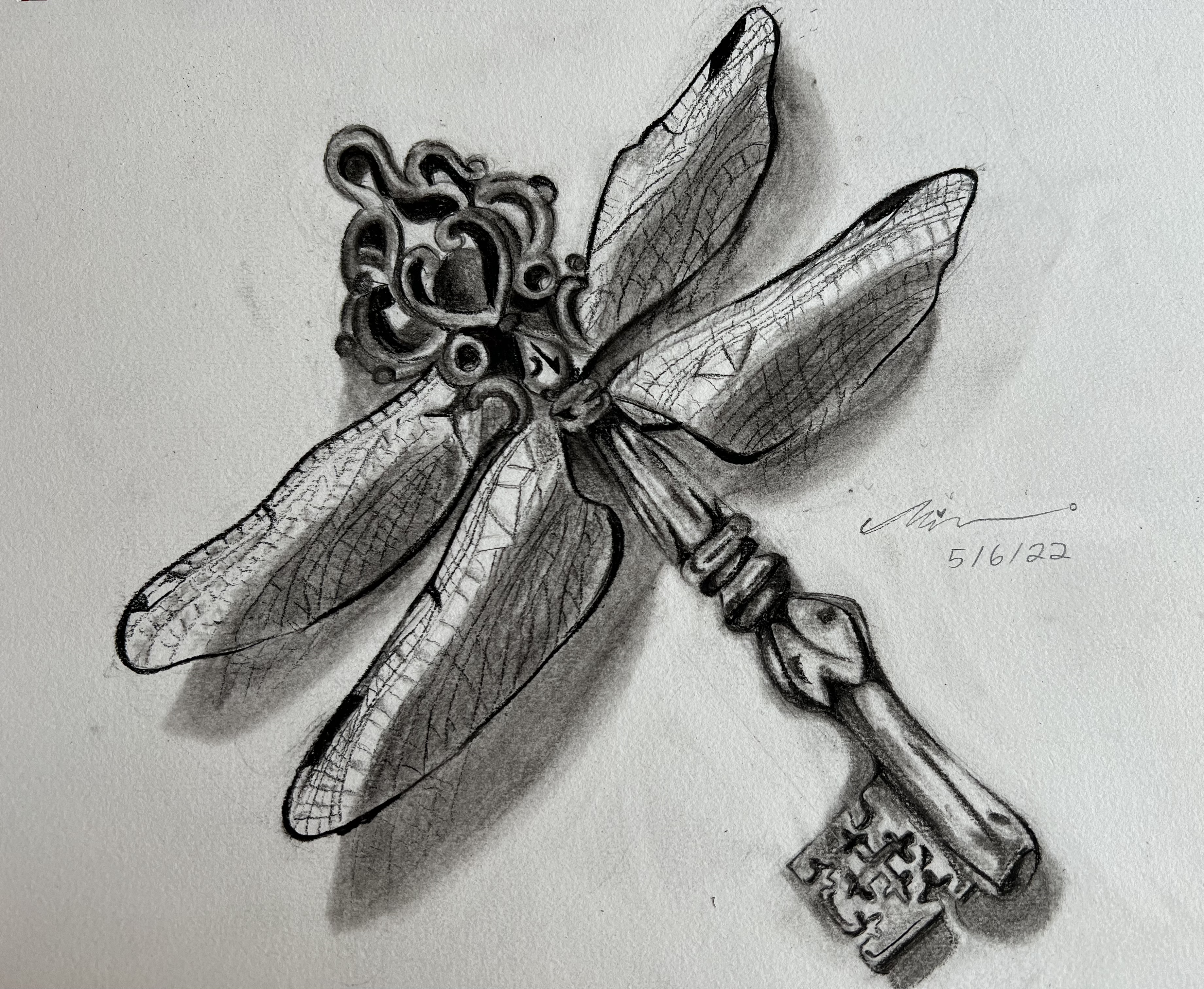 A pencil drawing of an ornate antique key styled as a dragonfly with detailed wings