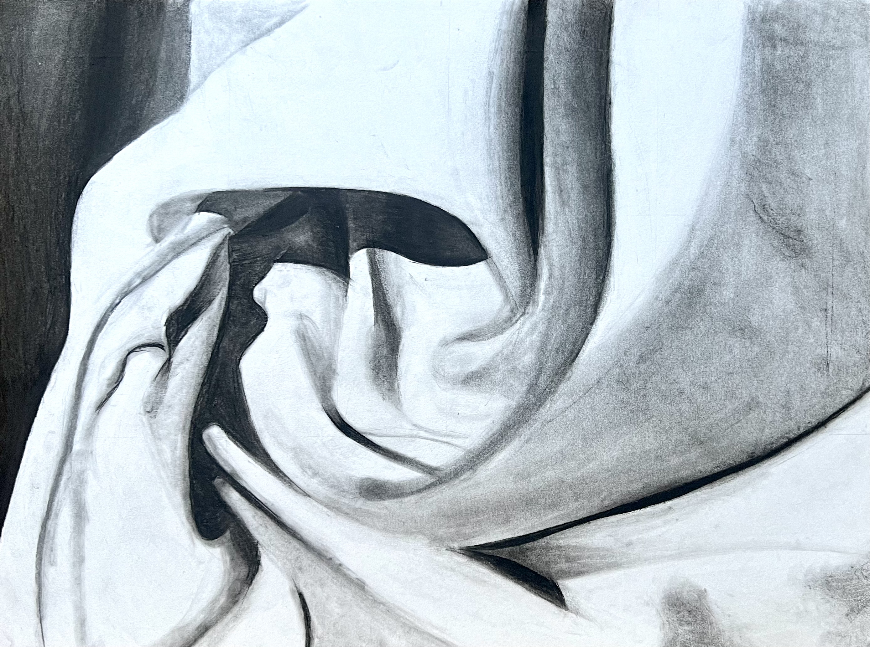 A charcoal study of draped white fabric, focused on the folds and shadows