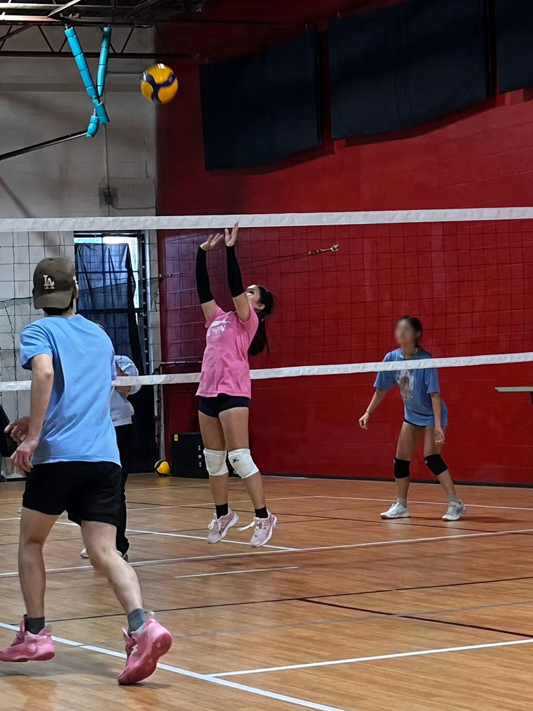 Mia setting the ball during a volleyball practice