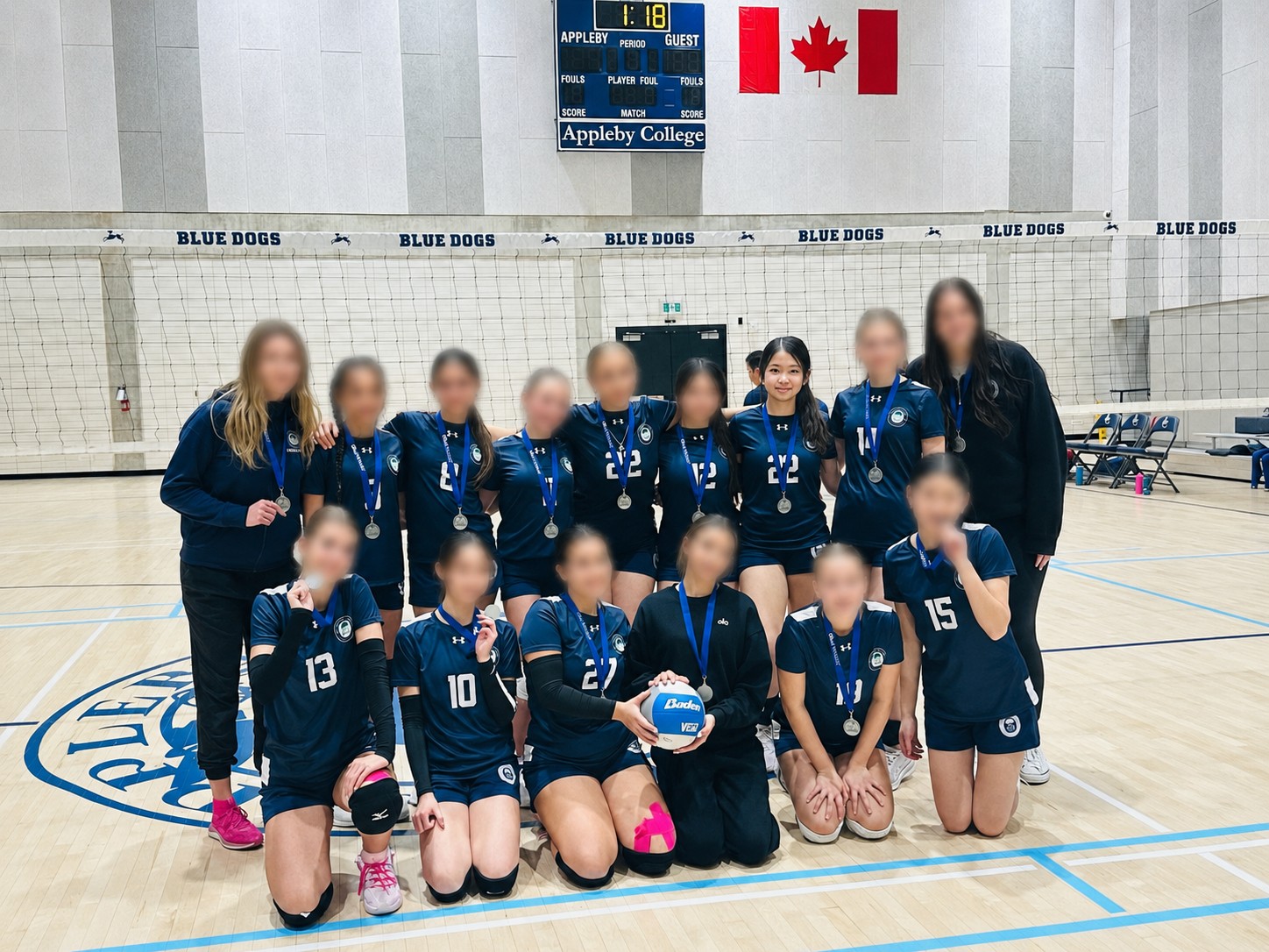 Mia's volleyball team posing together after a game